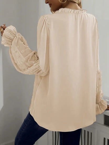 Nemirra – Elegante camicetta semitrasparente con bordi a volant