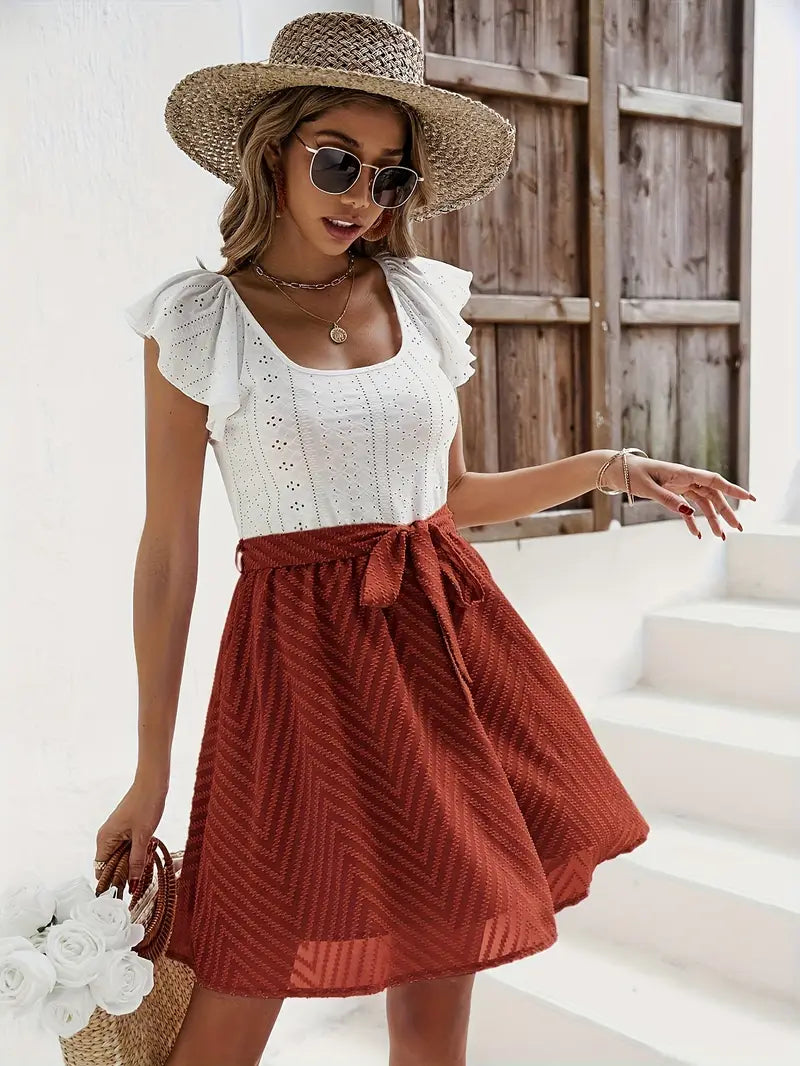 Wilhelmina – Set composto da top con maniche a cappuccio e gonna con cintura