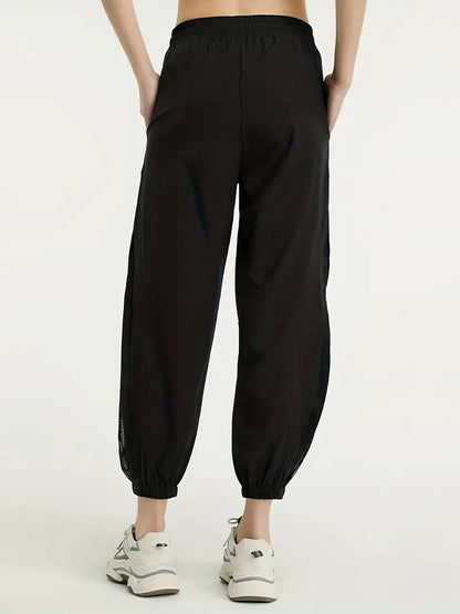 Hexaria – Pantaloni da jogging alla moda con dettagli in rete