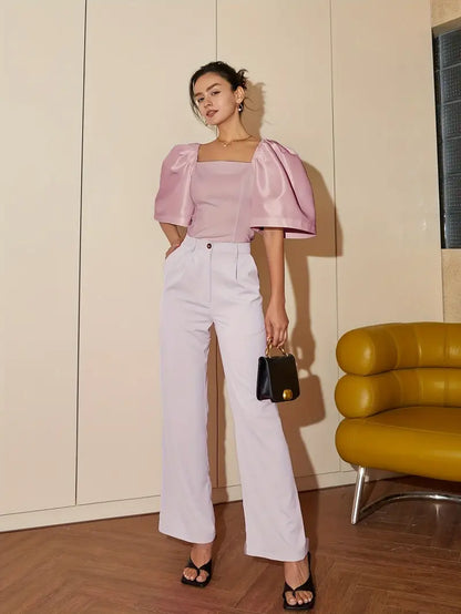 Clara – Elegante camicetta in satin con maniche a sbuffo