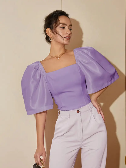 Clara – Elegante camicetta in satin con maniche a sbuffo