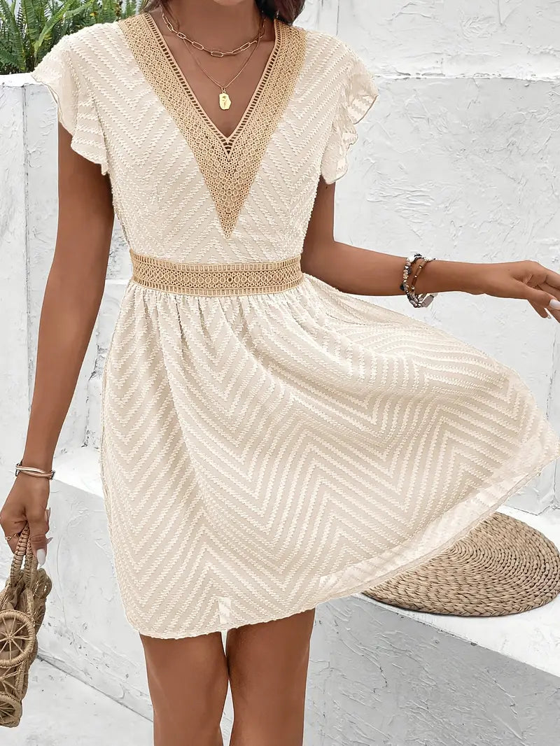 Yoshi – Mini abito boho con scollo a V e struttura