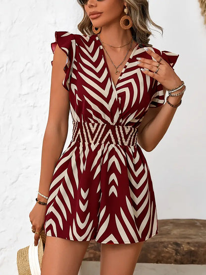 Tyronia – Elegante tutina con maniche arricciate