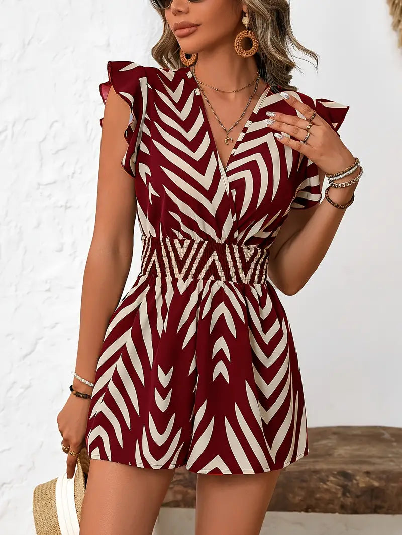 Alona – Tutina elegante con motivo a chevron e maniche a cappuccio