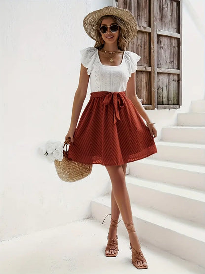 Wilhelmina – Set composto da top con maniche a cappuccio e gonna con cintura