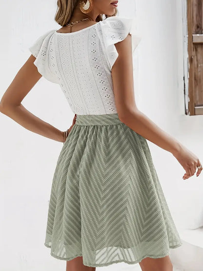 Caliah – Grazioso abito con maniche arricciate e occhielli