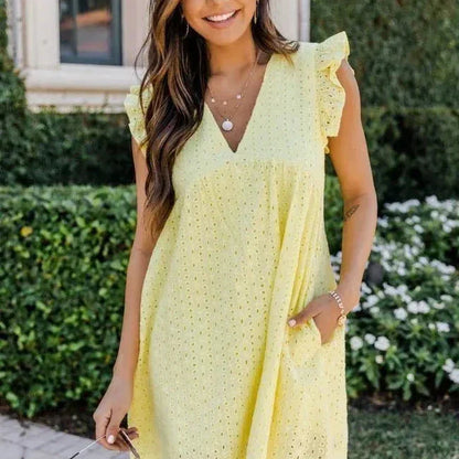 Claudia – Elegante miniabito con ricamo a occhielli