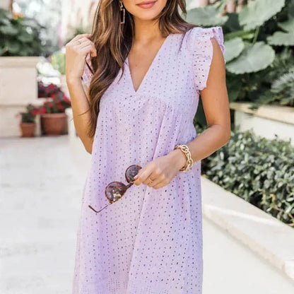 Claudia – Elegante miniabito con ricamo a occhielli