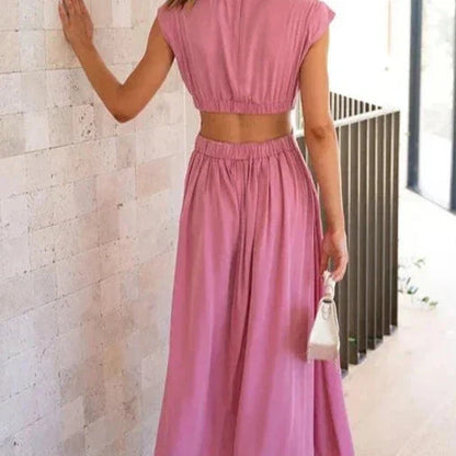 Aztrid – Elegante abito midi con ritagli e tasche