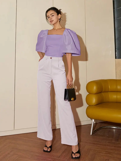 Clara – Elegante camicetta in satin con maniche a sbuffo