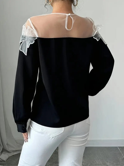 Majken – Elegante camicetta a maniche lunghe realizzata in tessuto a rete