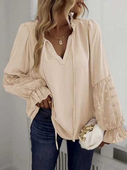 Nemirra – Elegante camicetta semitrasparente con bordi a volant