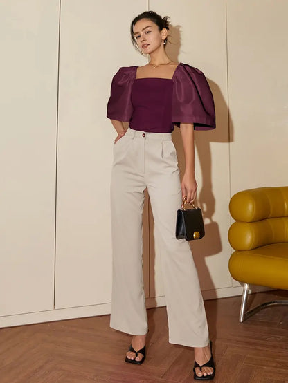 Clara – Elegante camicetta in satin con maniche a sbuffo