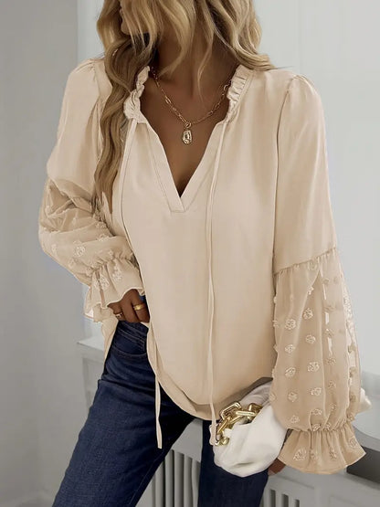 Nemirra – Elegante camicetta semitrasparente con bordi a volant