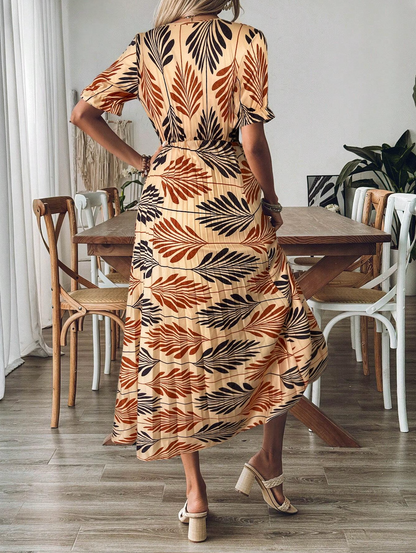 Genina – Abito midi plissettato con stampa di foglie tropicali